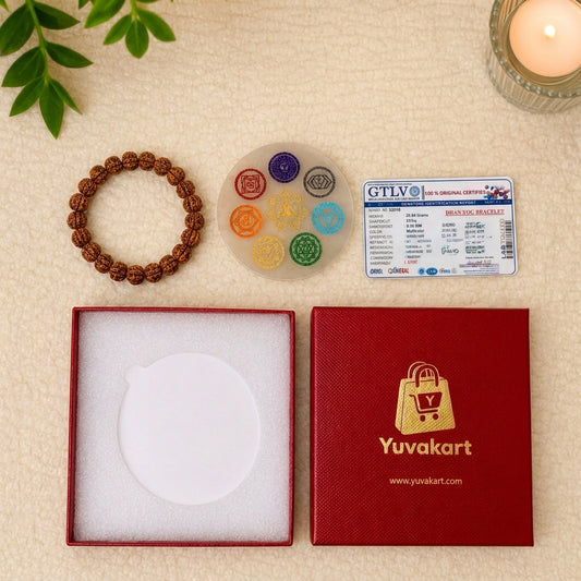 Bracelet, decorative stones, and a card on a beige surface with 'Yuvakart' branding.