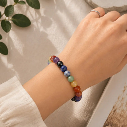 a girl wearing 7 chakra bracelet on her wrist