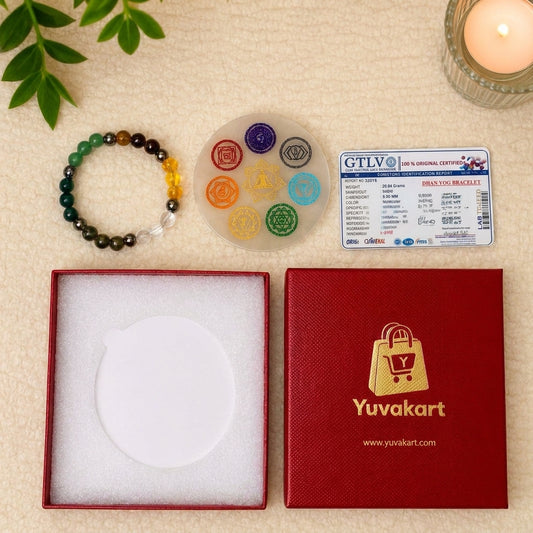 Colorful bracelet, transparent disc with symbols, GTLV card, and Yuvakart box on a beige surface.